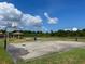 Outdoor community basketball court with two hoops at 13458 Graham Yarden Dr, Riverview, FL 33579