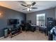 Bedroom with a desk, flat screen TV, and plenty of space at 13458 Graham Yarden Dr, Riverview, FL 33579