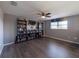 Spacious bedroom with built-in shelving and hardwood floors at 13458 Graham Yarden Dr, Riverview, FL 33579