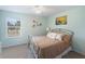 Bedroom with light-blue walls and a comfortable bed at 13458 Graham Yarden Dr, Riverview, FL 33579
