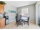 Kitchen breakfast nook with glass-top table and four chairs at 13458 Graham Yarden Dr, Riverview, FL 33579