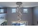View of a stunning crystal chandelier from below at 13458 Graham Yarden Dr, Riverview, FL 33579