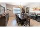Formal dining room with a large wooden table and bar at 13458 Graham Yarden Dr, Riverview, FL 33579