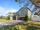 Two-story house with a green exterior, two-car garage, and landscaping at 13458 Graham Yarden Dr, Riverview, FL 33579