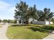 Two-story house with a green exterior and a large tree in front at 13458 Graham Yarden Dr, Riverview, FL 33579