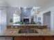 Kitchen with double sink, granite countertops, and island at 13458 Graham Yarden Dr, Riverview, FL 33579