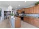 Open kitchen features ample cabinetry and an island at 13458 Graham Yarden Dr, Riverview, FL 33579