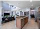 Island kitchen open to Gathering room, breakfast bar, and pantry at 13458 Graham Yarden Dr, Riverview, FL 33579