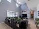 Living room with high ceilings, large windows, and sectional sofa at 13458 Graham Yarden Dr, Riverview, FL 33579