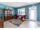 Living room with tiled floors, seating area and wooden cabinet at 13458 Graham Yarden Dr, Riverview, FL 33579