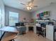 Home office with two work stations and built-in shelving at 13458 Graham Yarden Dr, Riverview, FL 33579