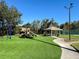 Modern playground with turf and gazebo at 13458 Graham Yarden Dr, Riverview, FL 33579