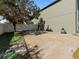 Side yard with concrete slab and gate at 13458 Graham Yarden Dr, Riverview, FL 33579