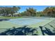 Well-maintained tennis court with green surface at 13458 Graham Yarden Dr, Riverview, FL 33579