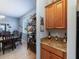 Wet bar with granite countertop and wooden cabinets at 13458 Graham Yarden Dr, Riverview, FL 33579