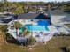 Community pool with spa, ample deck space, and surrounding landscaping at 1400 Gandy N Blvd # 506, St Petersburg, FL 33702