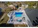 Community pool and spa surrounded by a white fence and lush landscaping at 1400 Gandy N Blvd # 506, St Petersburg, FL 33702