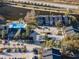 Aerial view of community with pool, parking and surrounding landscape at 1400 Gandy N Blvd # 506, St Petersburg, FL 33702