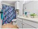 Clean bathroom with a polka dot shower curtain and vanity at 1400 Gandy N Blvd # 506, St Petersburg, FL 33702