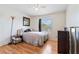 Cozy bedroom with light wood floors and ample natural light at 1400 Gandy N Blvd # 506, St Petersburg, FL 33702