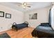 Bedroom with two twin beds, wood floors, and a ceiling fan at 1400 Gandy N Blvd # 506, St Petersburg, FL 33702