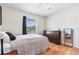 Well-lit bedroom with wood floors and a large window at 1400 Gandy N Blvd # 506, St Petersburg, FL 33702
