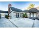 Community clubhouse with two entrances, landscaping, and a paved patio at 1400 Gandy N Blvd # 506, St Petersburg, FL 33702