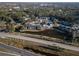 Aerial view of apartment community near a lake and highway at 1400 Gandy N Blvd # 506, St Petersburg, FL 33702