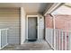 Private entrance with a wooden deck and brick accents at 1400 Gandy N Blvd # 506, St Petersburg, FL 33702