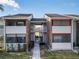 Condo building exterior with walkway and screened balcony at 1400 Gandy N Blvd # 506, St Petersburg, FL 33702