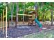 Community playground set in a wooded area at 1400 Gandy N Blvd # 506, St Petersburg, FL 33702