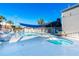 Inviting community pool and spa with lounge chairs and shade structure at 1400 Gandy N Blvd # 506, St Petersburg, FL 33702