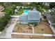 Aerial view showing house, pool, and backyard at 1534 Wexford N Dr, Palm Harbor, FL 34683