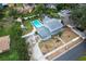 House with pool, driveway, and surrounding homes at 1534 Wexford N Dr, Palm Harbor, FL 34683