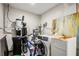 Unfinished basement with water heater, water softener, and washer at 1534 Wexford N Dr, Palm Harbor, FL 34683