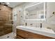 Spa-like bathroom with double vanity, a large mirror, and glass shower at 1534 Wexford N Dr, Palm Harbor, FL 34683