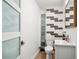Modern bathroom with white vanity, tile shower, and updated fixtures at 1534 Wexford N Dr, Palm Harbor, FL 34683