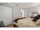 Bedroom with a double bed, white closet doors and access to another room at 1534 Wexford N Dr, Palm Harbor, FL 34683