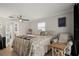 Main bedroom with king bed, ensuite access and sitting area at 1534 Wexford N Dr, Palm Harbor, FL 34683