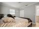 Bedroom with double bed, white closet doors, and access to a hallway at 1534 Wexford N Dr, Palm Harbor, FL 34683