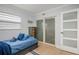 Bedroom with a single bed, dresser, and frosted glass closet doors at 1534 Wexford N Dr, Palm Harbor, FL 34683