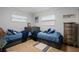 Cozy bedroom with twin beds, dresser, and light-grey walls at 1534 Wexford N Dr, Palm Harbor, FL 34683