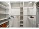 Large walk-in closet with ample shelving and hanging space at 1534 Wexford N Dr, Palm Harbor, FL 34683