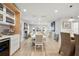 Dining room with a white table, beige chairs, and a view of the kitchen at 1534 Wexford N Dr, Palm Harbor, FL 34683