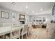 Bright dining room with a white table and fireplace at 1534 Wexford N Dr, Palm Harbor, FL 34683