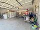 Spacious garage with overhead door, storage cabinets, and room for multiple vehicles at 1534 Wexford N Dr, Palm Harbor, FL 34683
