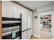 Modern kitchen with stainless steel appliances and walk-in pantry at 1534 Wexford N Dr, Palm Harbor, FL 34683