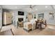 Living room with vaulted ceiling, fireplace and built-in shelving at 1534 Wexford N Dr, Palm Harbor, FL 34683