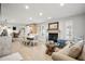 Living room with light beige couch, white dining table and fireplace at 1534 Wexford N Dr, Palm Harbor, FL 34683