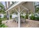 Charming patio with covered seating area and brick flooring at 1534 Wexford N Dr, Palm Harbor, FL 34683